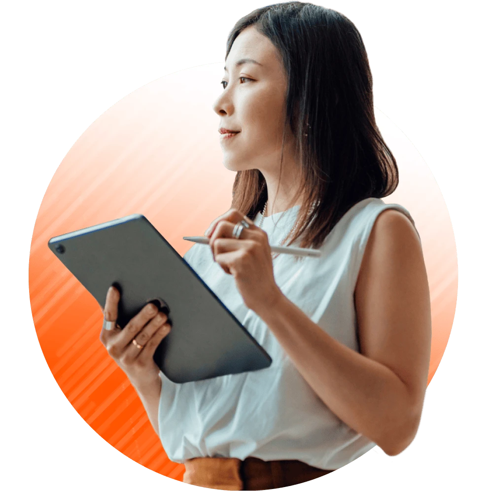A woman holding a tablet and stylus.