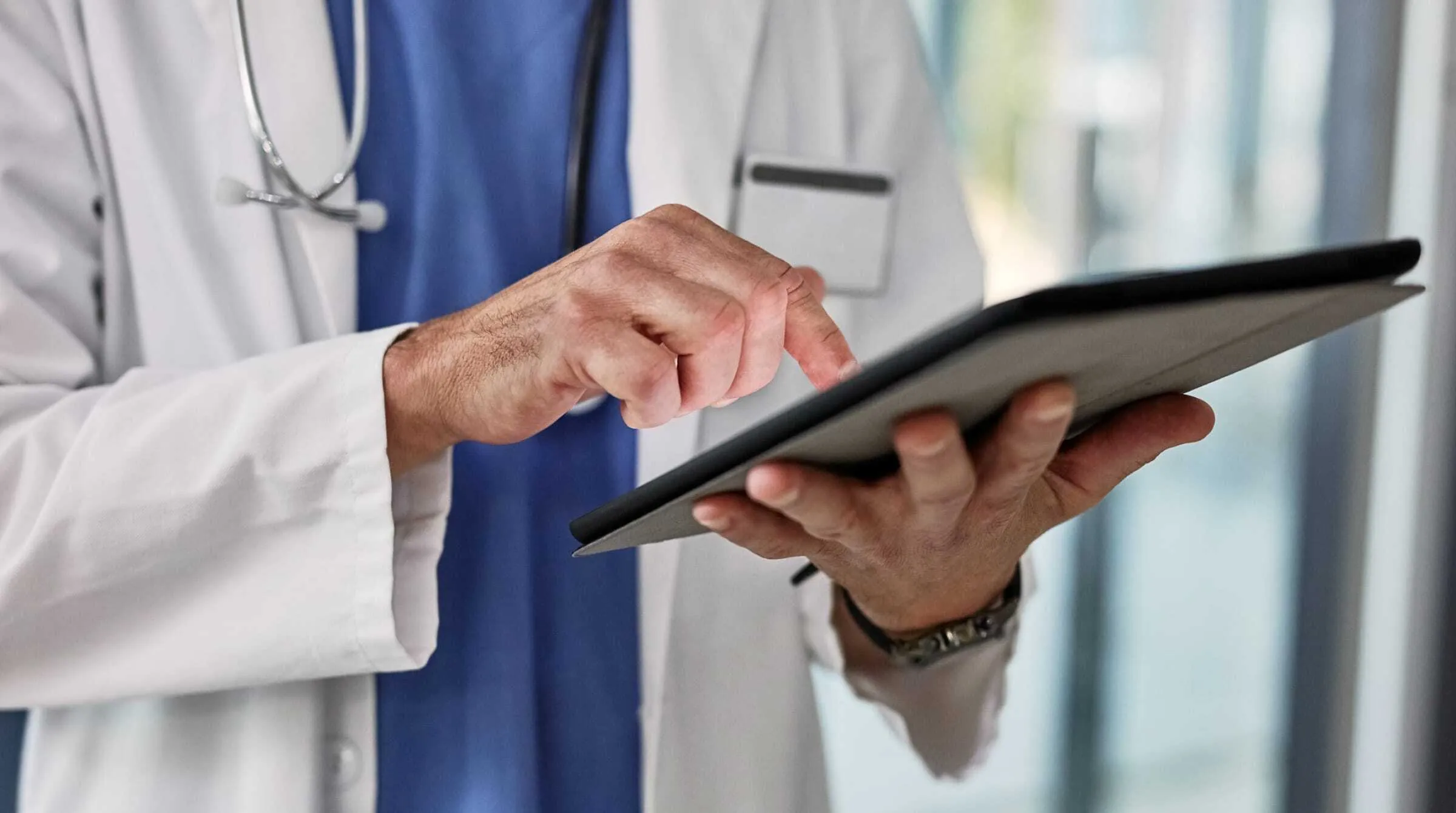 Physician using tablet